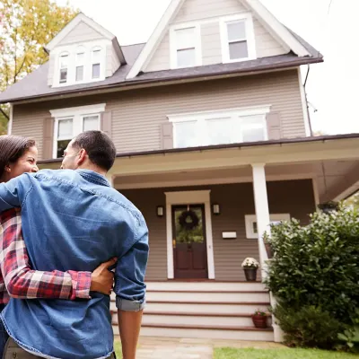 couple-outside-house